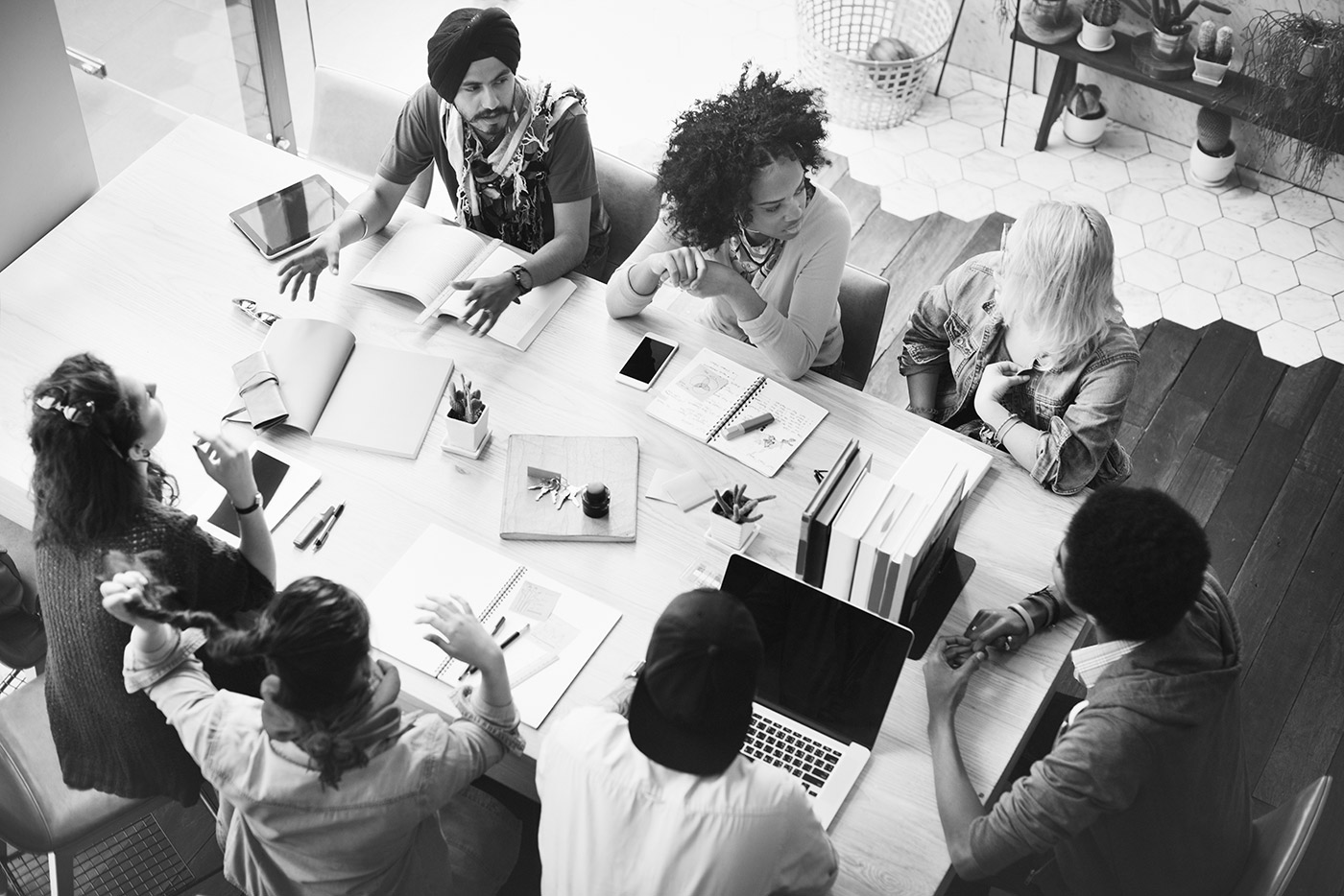 a group of people talking at a table